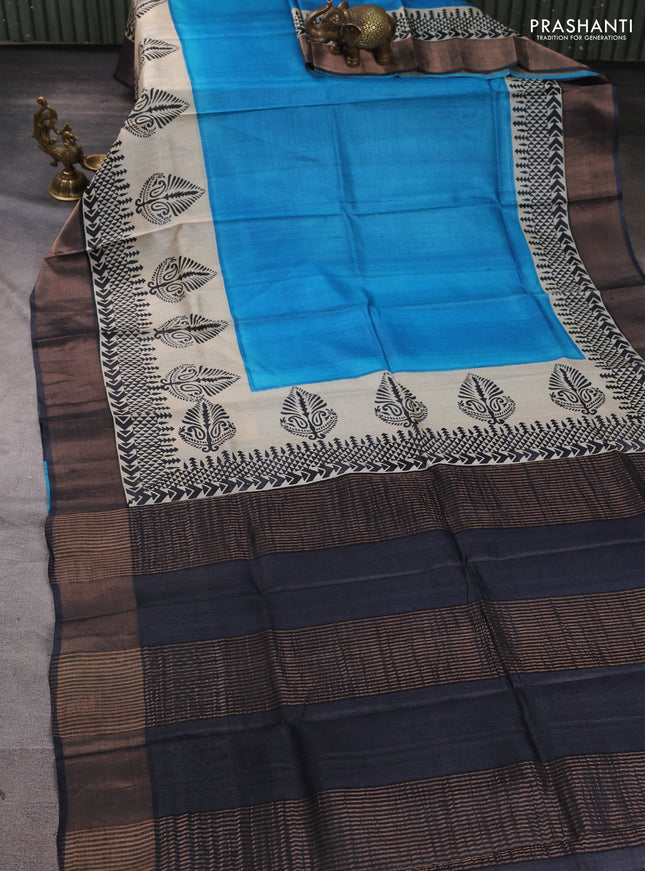 Pure tussar silk saree cs blue and beige black with plain body and long printed zari woven border