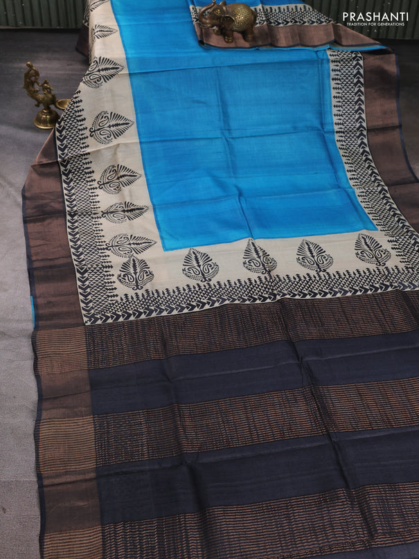 Pure tussar silk saree cs blue and beige black with plain body and long printed zari woven border