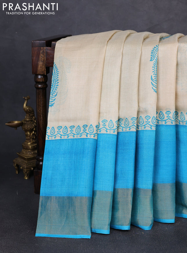 Pure tussar silk saree beige and teal blue with paisley butta prints and long simple zari woven border