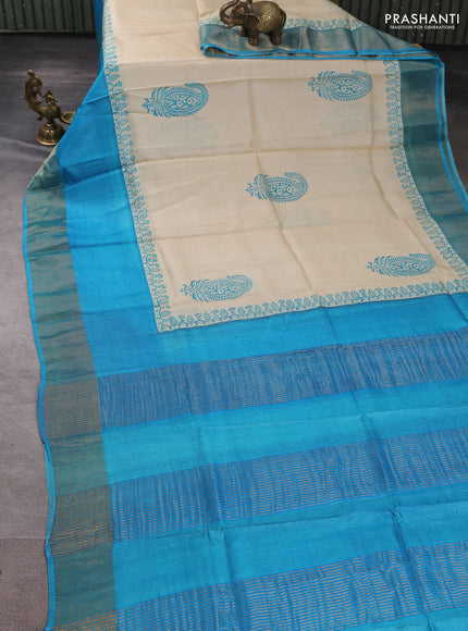 Pure tussar silk saree beige and teal blue with paisley butta prints and long simple zari woven border