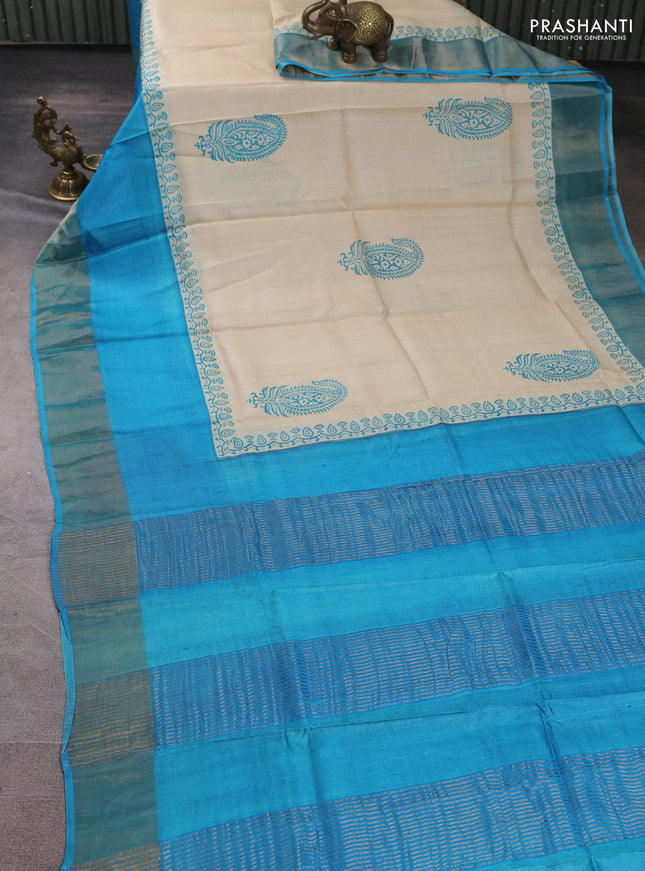 Pure tussar silk saree beige and teal blue with paisley butta prints and long simple zari woven border