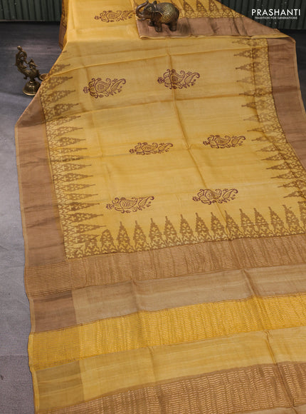 Pure tussar silk saree mustard yellow and dark beige with paisley butta prints and temple design zari woven border