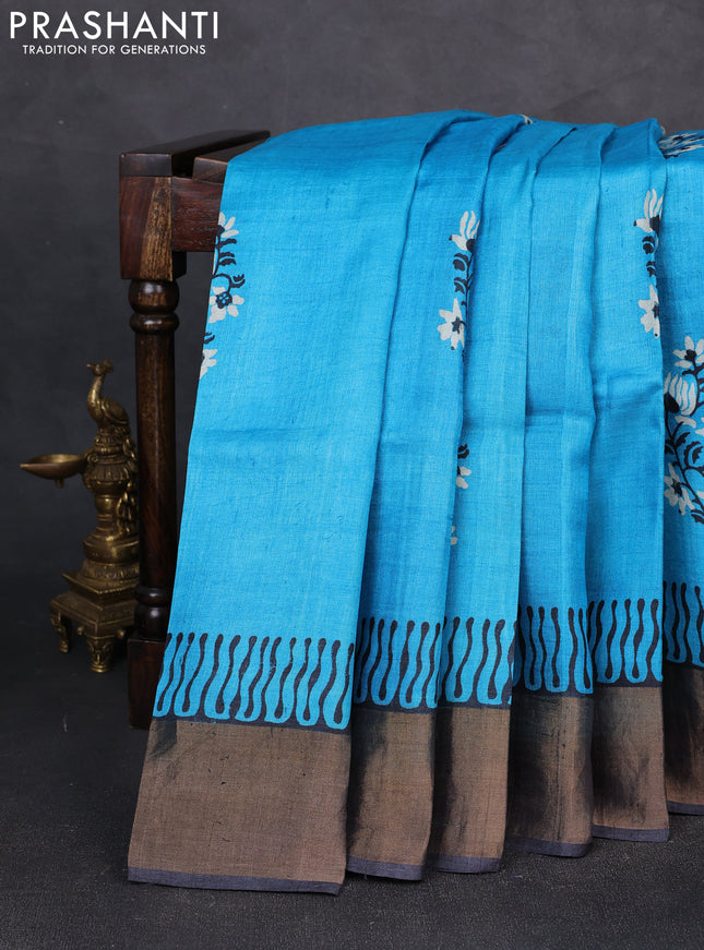 Pure tussar silk saree cs blue and black with floral butta prints and zari woven border