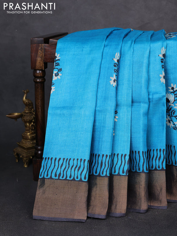 Pure tussar silk saree cs blue and black with floral butta prints and zari woven border