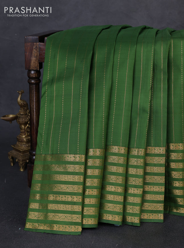 Pure kanchipuram silk saree green with allover zari weaves and long zari woven paisley border