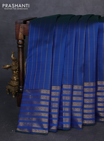 Pure kanchipuram silk saree blue with allover zari weaves and long zari woven paisley border