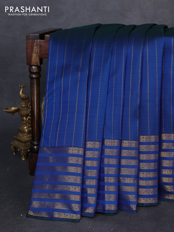 Pure kanchipuram silk saree blue with allover zari weaves and long zari woven paisley border