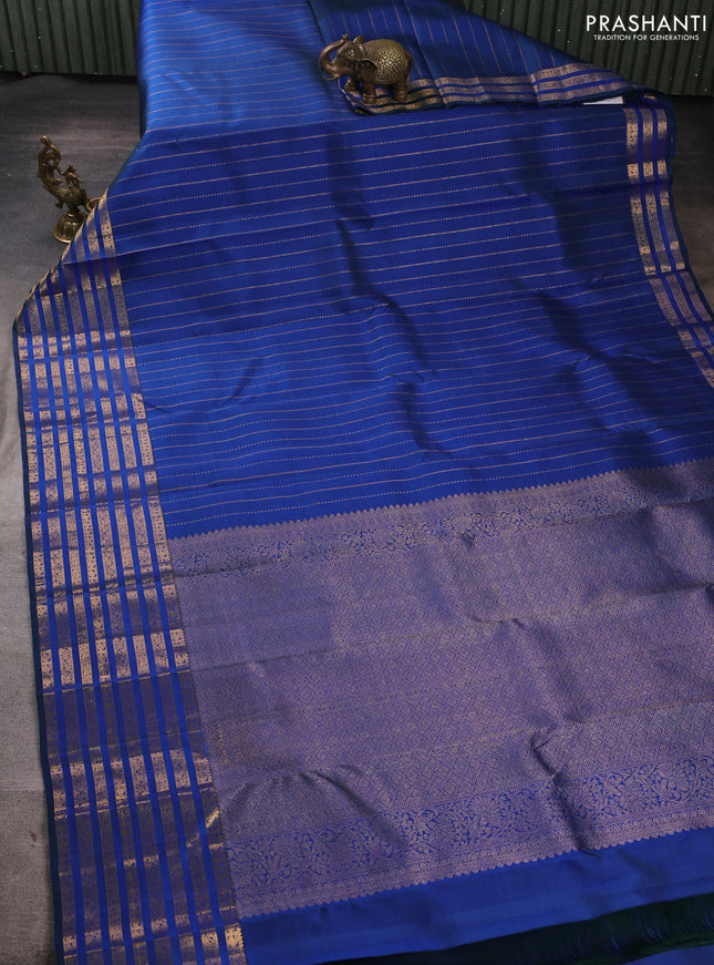 Pure kanchipuram silk saree blue with allover zari weaves and long zari woven paisley border