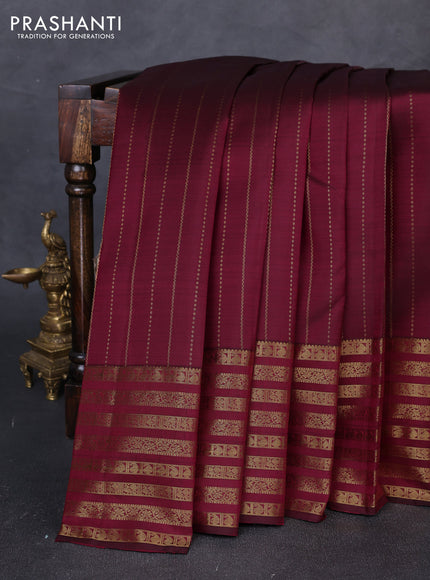 Pure kanchipuram silk saree dark magenta pink with allover zari weaves and long zari woven paisley border