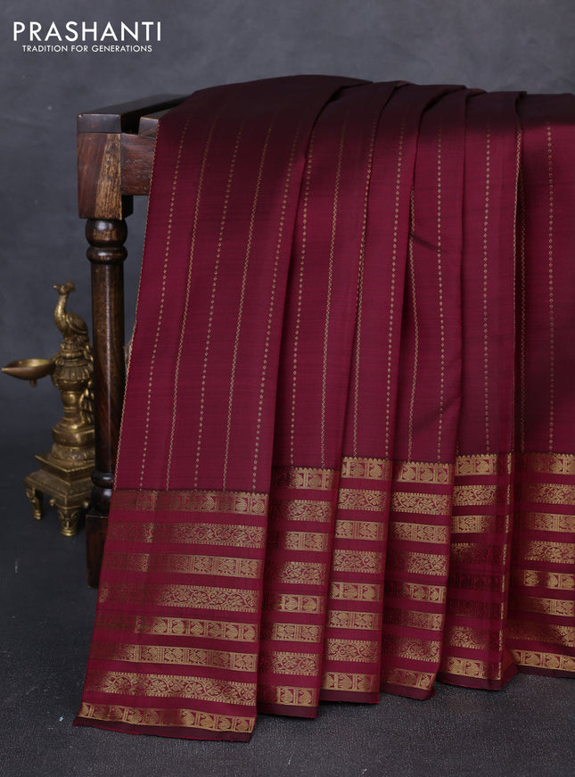 Pure kanchipuram silk saree dark magenta pink with allover zari weaves and long zari woven paisley border