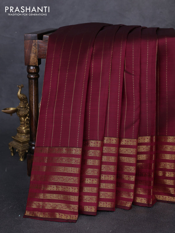 Pure kanchipuram silk saree dark magenta pink with allover zari weaves and long zari woven paisley border