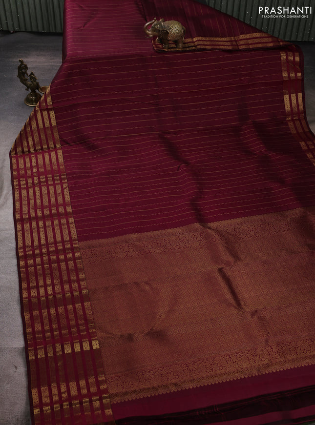 Pure kanchipuram silk saree dark magenta pink with allover zari weaves and long zari woven paisley border