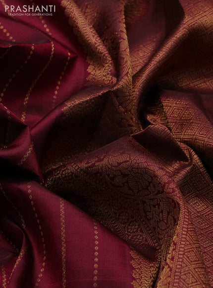 Pure kanchipuram silk saree dark magenta pink with allover zari weaves and long zari woven paisley border