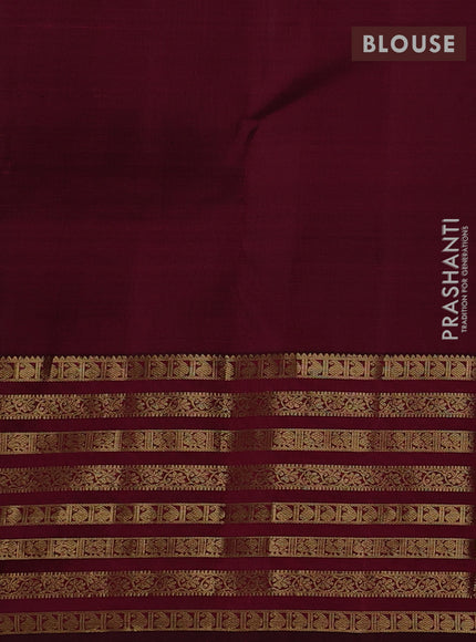 Pure kanchipuram silk saree dark magenta pink with allover zari weaves and long zari woven paisley border
