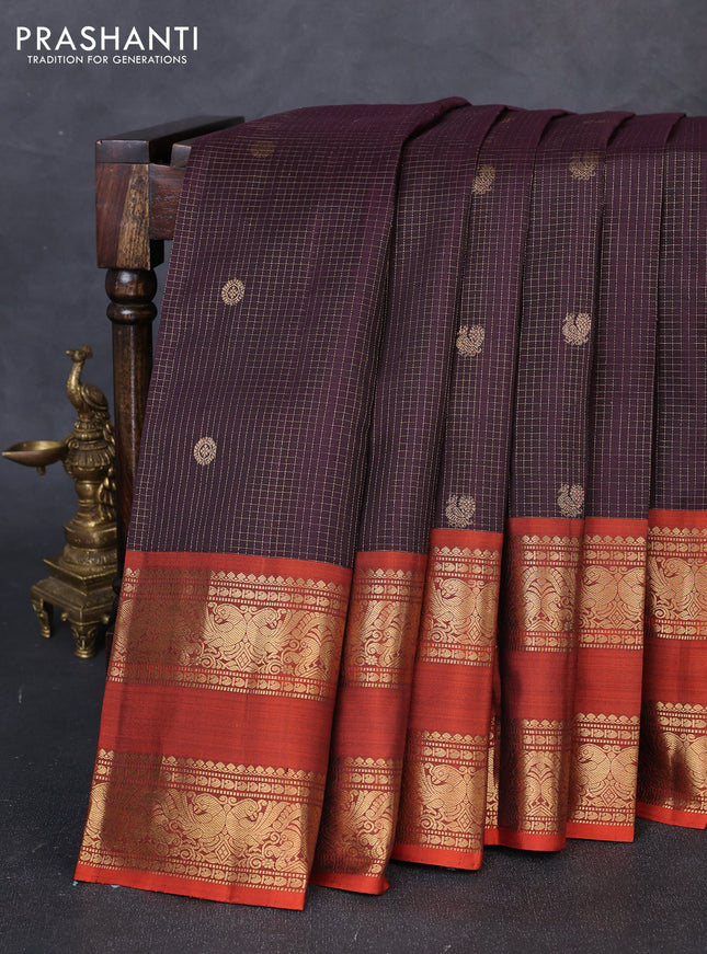 Pure kanchipuram silk saree deep jamun and rustic orange with allover small zari checks & buttas and long rettapet zari woven border