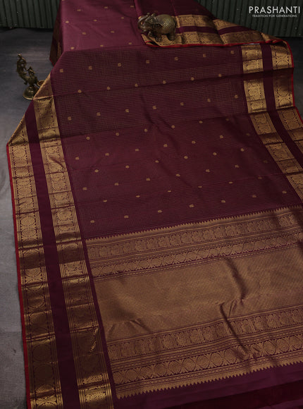 Pure kanchipuram silk saree wine shade with allover small zari checks & buttas and long rettapet zari woven border