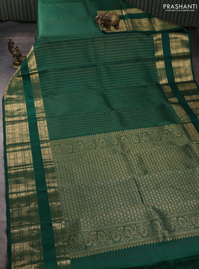Pure kanchipuram silk saree green with allover small zari checks & buttas and long rettapet zari woven border