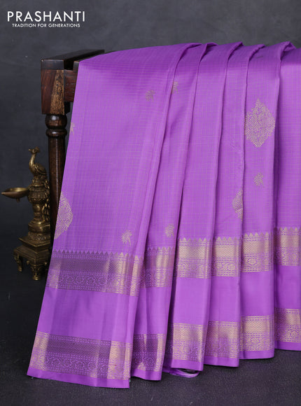 Pure kanchipuram silk saree lavender with allover small zari checks & buttas and long rettapet zari woven border
