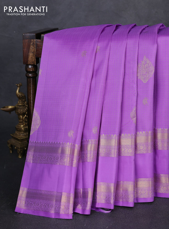 Pure kanchipuram silk saree lavender with allover small zari checks & buttas and long rettapet zari woven border