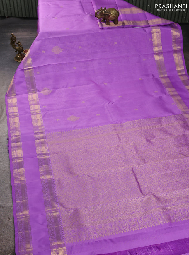 Pure kanchipuram silk saree lavender with allover small zari checks & buttas and long rettapet zari woven border