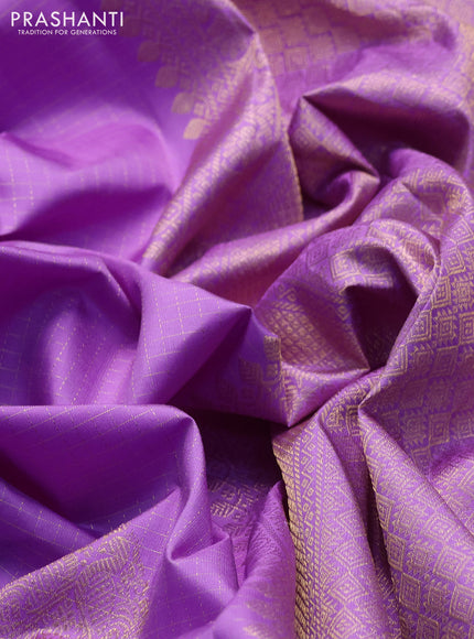 Pure kanchipuram silk saree lavender with allover small zari checks & buttas and long rettapet zari woven border