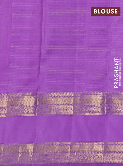 Pure kanchipuram silk saree lavender with allover small zari checks & buttas and long rettapet zari woven border