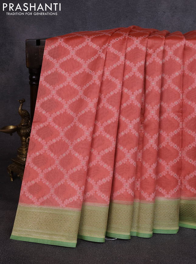 Banarasi silk cotton saree peach orange and light green with allover thread weaves and thread & zari woven border