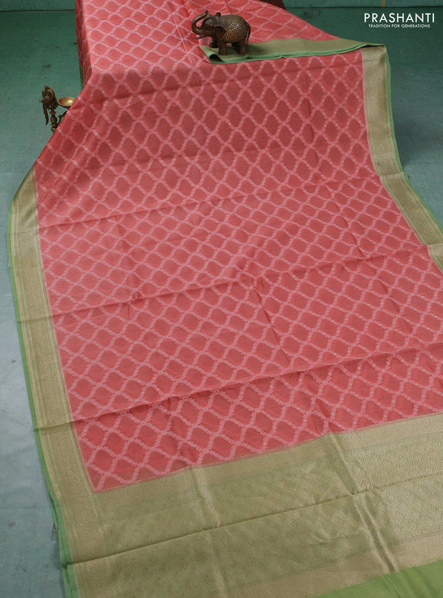Banarasi silk cotton saree peach orange and light green with allover thread weaves and thread & zari woven border