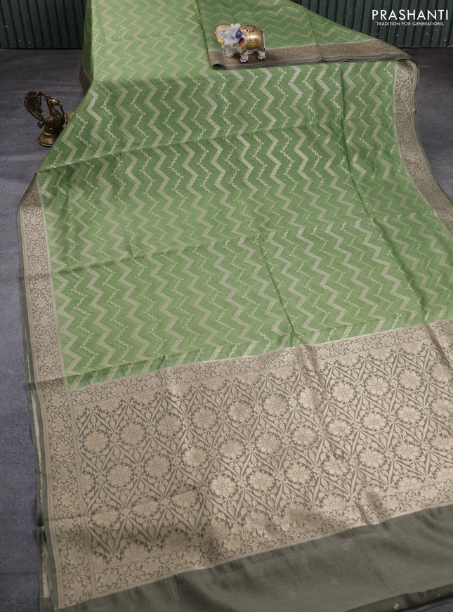 Banarasi silk cotton saree pastel green and grey shade with allover thread & zari weaves and woven border