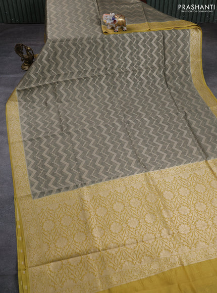 Banarasi silk cotton saree pastel green and yellow with allover thread & zari weaves and woven border