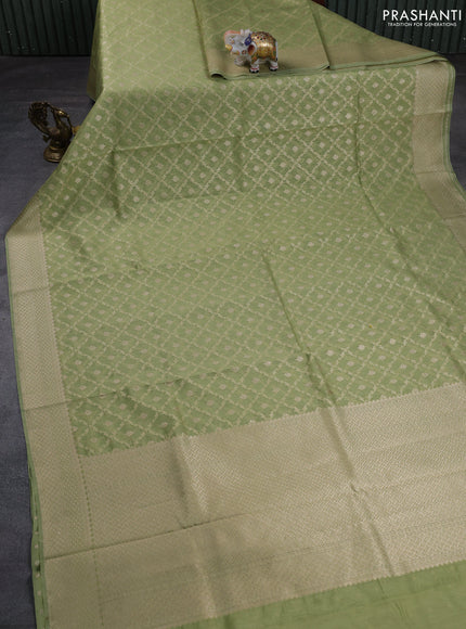 Banarasi silk cotton saree pastel green with allover thread & zari weaves and woven border