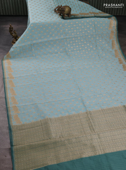 Banarasi silk cotton saree pastel blue and peacock green with allover thread & zari woven buttas and pichwai woven border