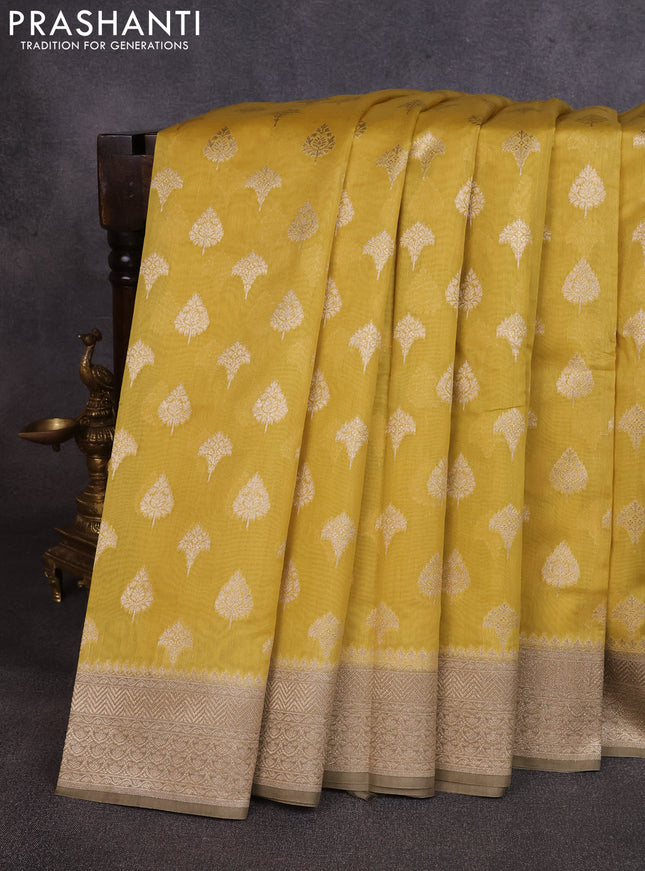 Banarasi silk cotton saree mustard yellow and grey shade with allover thread & zari woven buttas and woven border