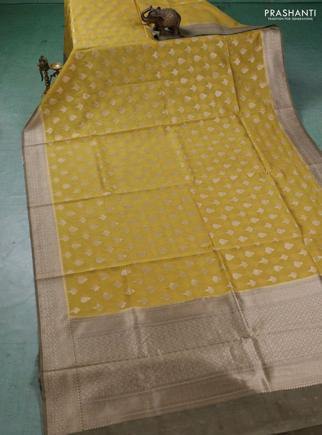 Banarasi silk cotton saree mustard yellow and grey shade with allover thread & zari woven buttas and woven border