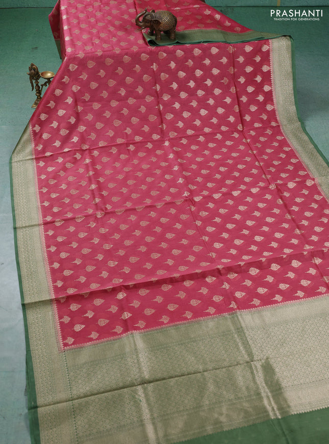 Banarasi silk cotton saree dark peach and green with allover thread & zari woven buttas and woven border