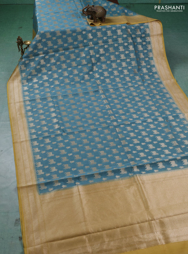 Banarasi silk cotton saree pastel blue and mustard yellow with allover thread & zari pichwai buttas and woven border