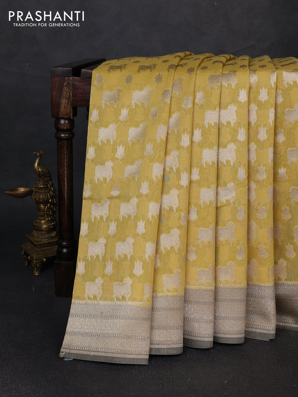 Banarasi silk cotton saree mustard yellow and grey shade with allover thread & zari pichwai buttas and woven border