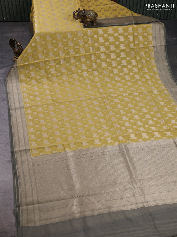 Banarasi silk cotton saree mustard yellow and grey shade with allover thread & zari pichwai buttas and woven border