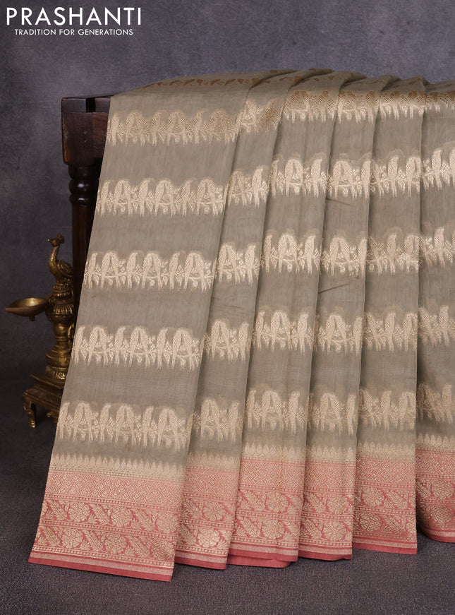 Banarasi silk cotton saree pastel green and dark peach with allover thread & zari weaves and woven border