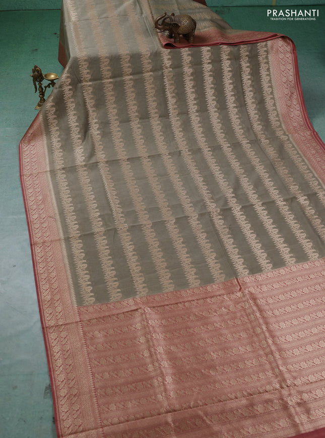 Banarasi silk cotton saree pastel green and dark peach with allover thread & zari weaves and woven border