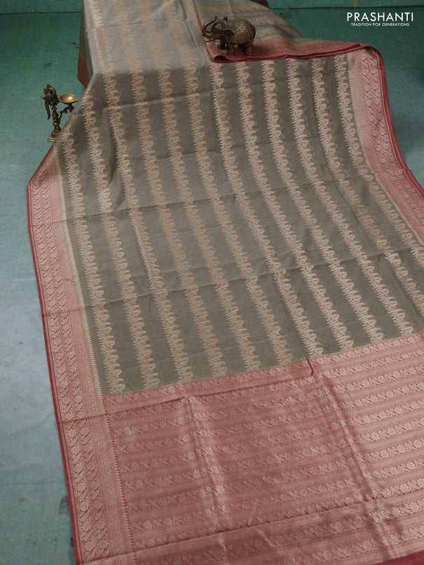 Banarasi silk cotton saree pastel green and dark peach with allover thread & zari weaves and woven border