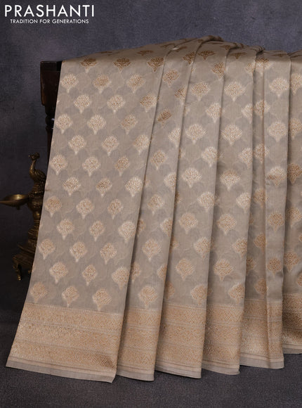Banarasi silk cotton saree beige with allover thread & zari woven buttas and woven border