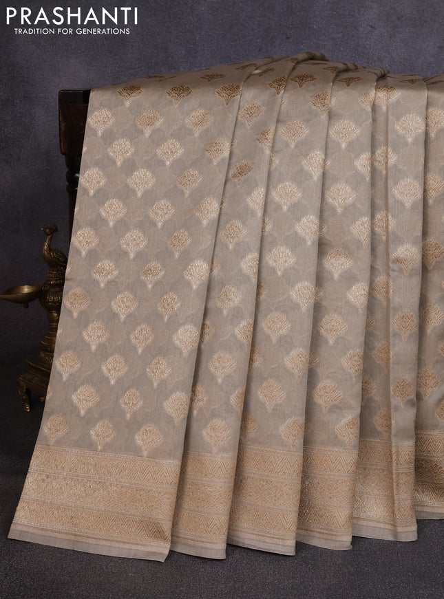 Banarasi silk cotton saree beige with allover thread & zari woven buttas and woven border