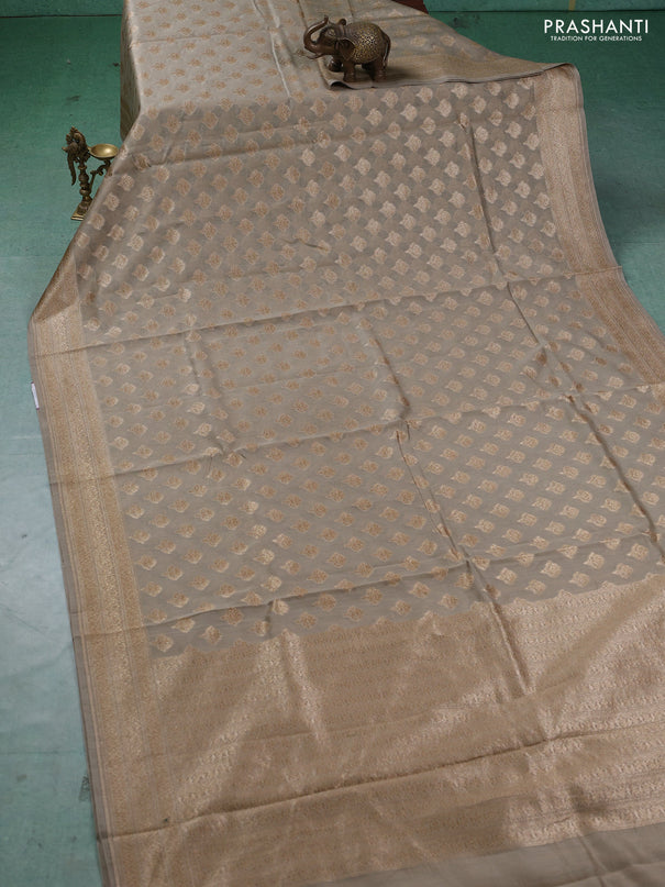 Banarasi silk cotton saree beige with allover thread & zari woven buttas and woven border