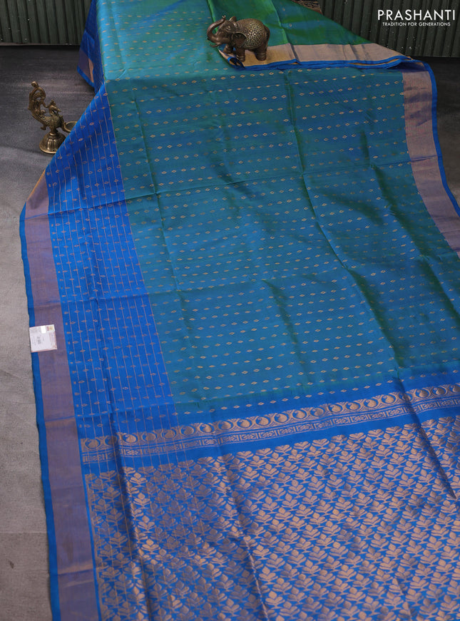 Pure uppada silk saree dual shade of teal bluish green and cs blue with allover zari woven buttas and long zari woven border