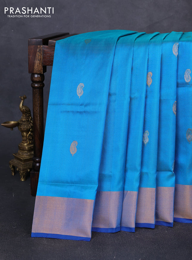 Pure uppada silk saree teal blue and blue with silver & gold zari woven paisley buttas and zari woven border