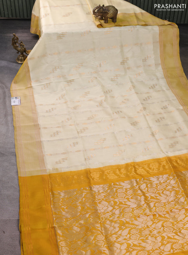 Pure uppada silk saree cream and mustard yellow with allover zari weaves & buttas and rettapet zari woven border
