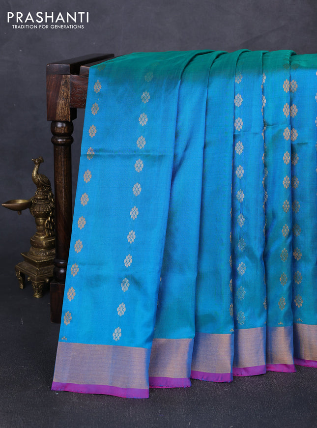 Pure uppada silk saree dual shade of teal blue and pink with allover silver & gold zari woven floral buttas and zari woven border