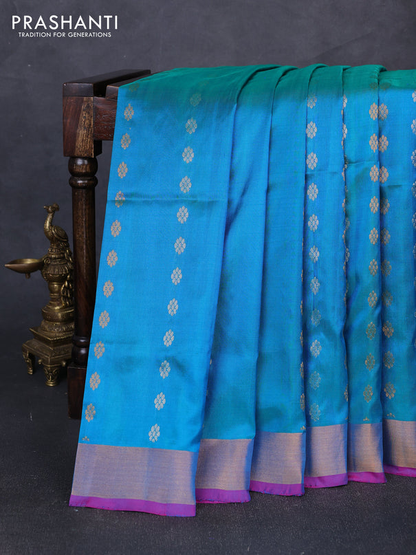 Pure uppada silk saree dual shade of teal blue and pink with allover silver & gold zari woven floral buttas and zari woven border