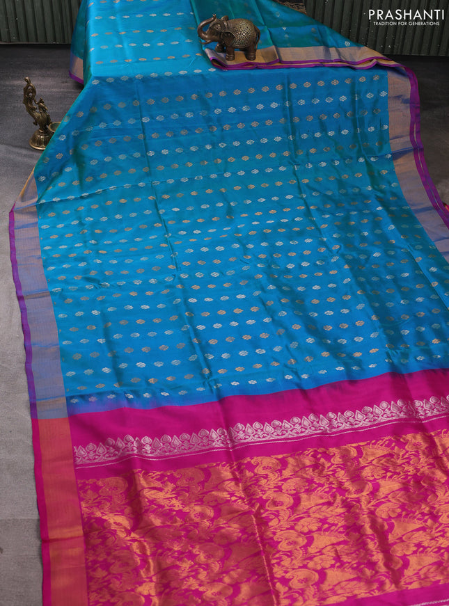 Pure uppada silk saree dual shade of teal blue and pink with allover silver & gold zari woven floral buttas and zari woven border